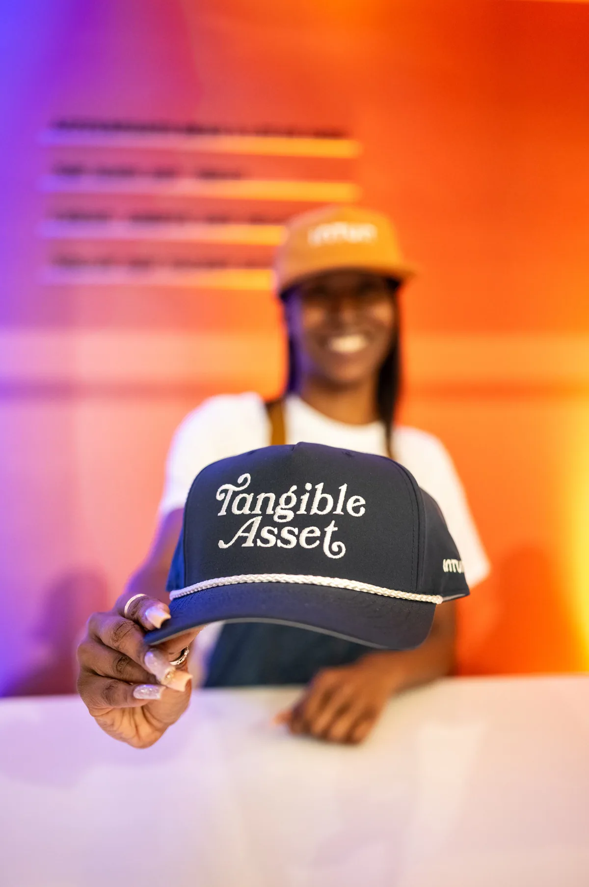Attendee showing an embroidered Intuit cap