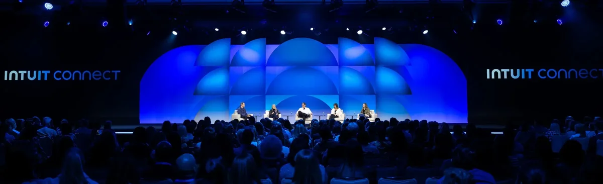 Intuit Connect main stage in blue light before a full audience