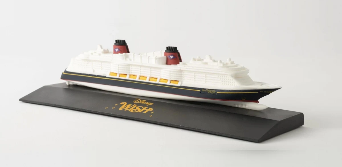 Model of the Disney Wish cruise ship on a black base