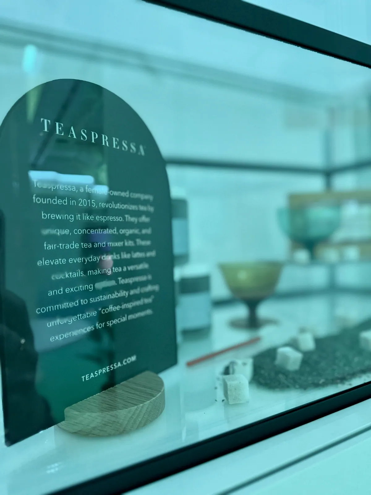Small business story card in a glass display case
