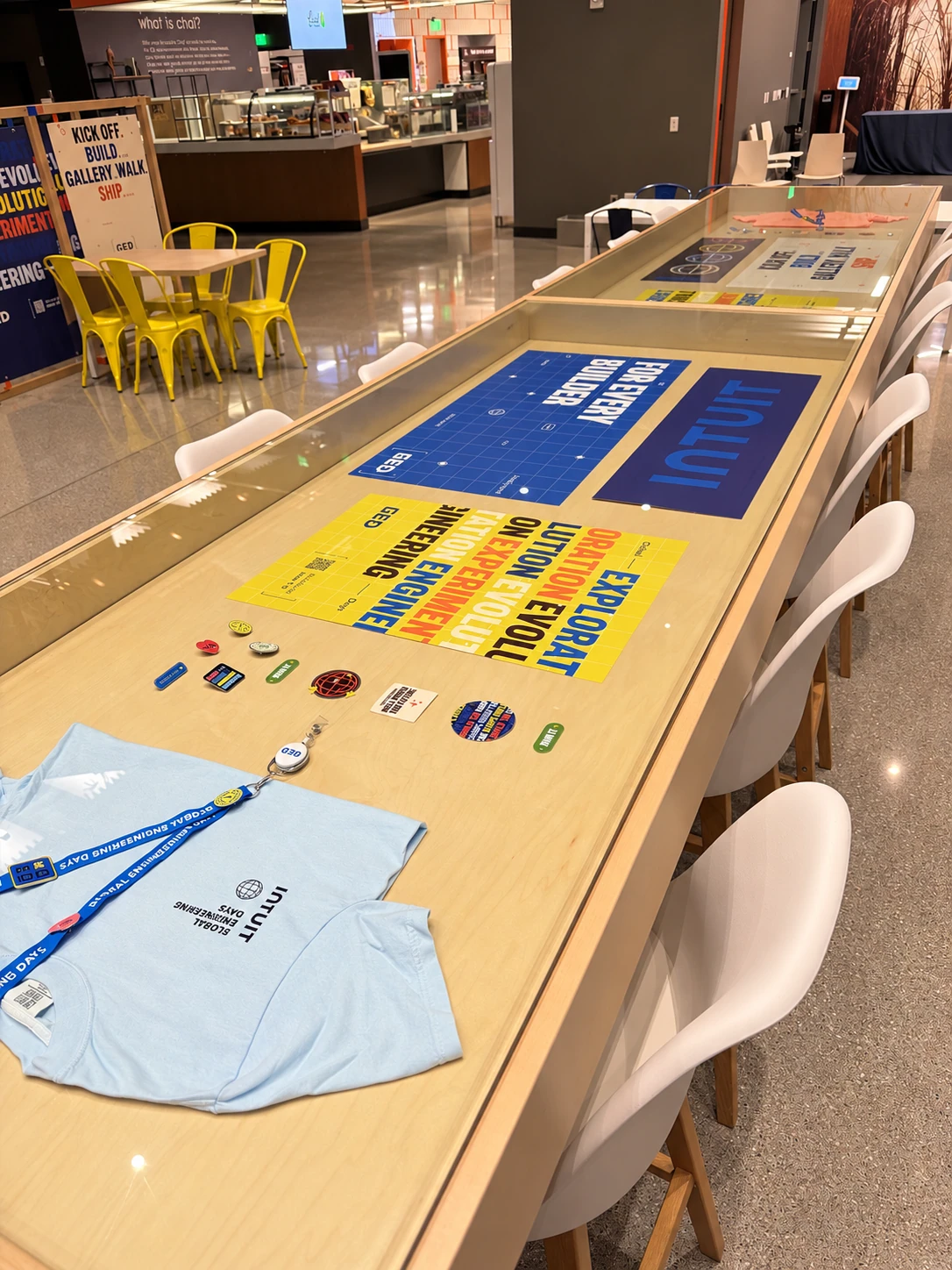Display table with GED posters, pins, lanyard and t-shirt