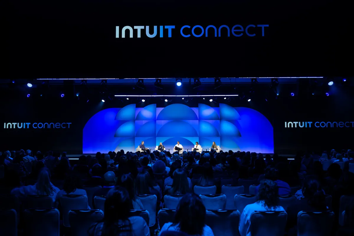 Intuit Connect main stage in blue light before a full audience