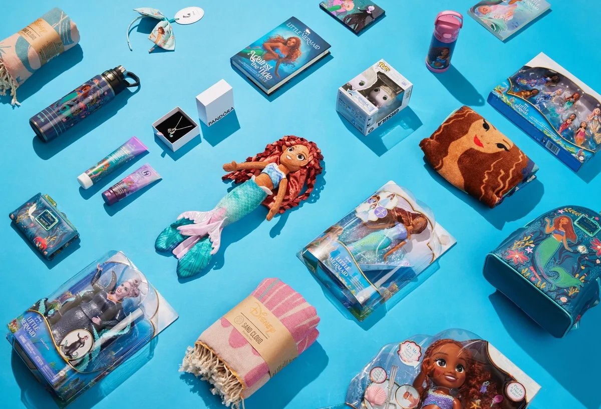 The Little Mermaid amenities laid out on blue