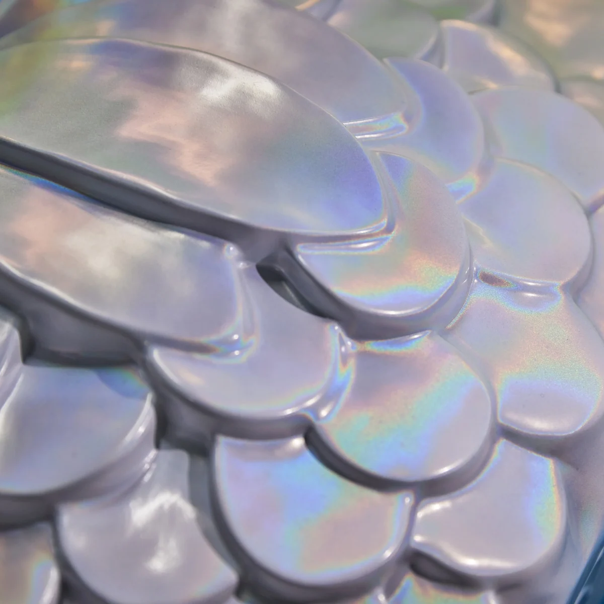 Iridescent scalloped lid of the Little Mermaid box